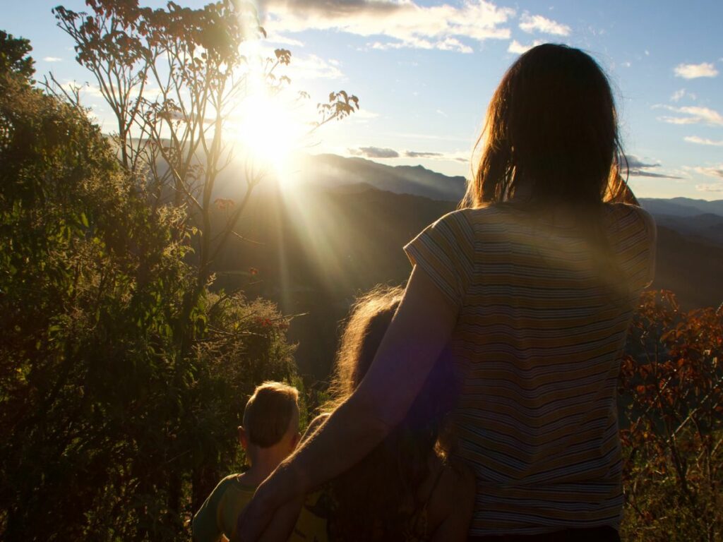 Family watching the sun set.