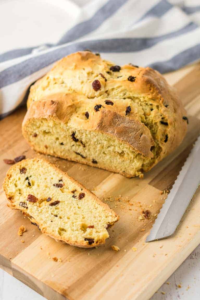 A loaf of yeast-free Irish soda bread on a cutting board.