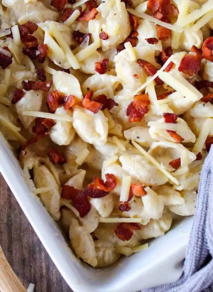 Carbonara macaroni in a white baking dish.