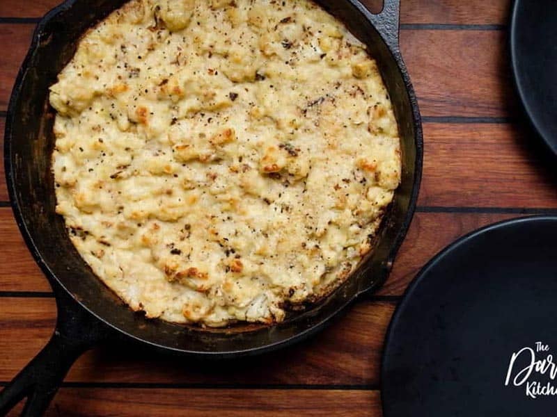 Cauliflower mac and cheese in cast iron skillet.