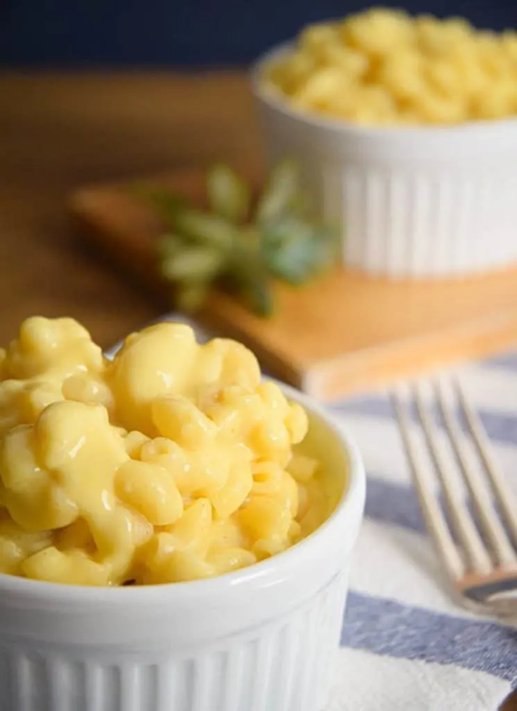 Electric skillet macaroni and cheese in a white ramekin.