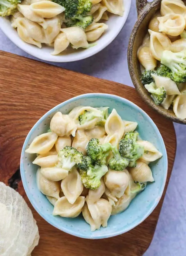 Three bowls of instant pot macaroni and cheese broccoli.
