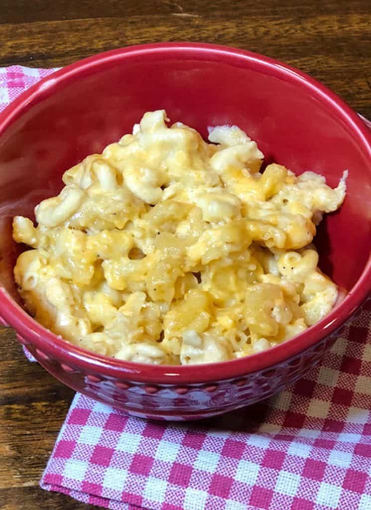 No boil crock pot macaroni and cheese in a red bowl.