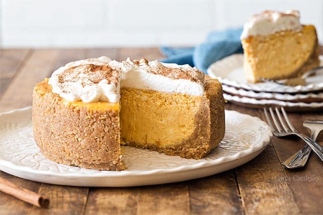 Mini pumpkin cheesecake sliced open in a plate.
