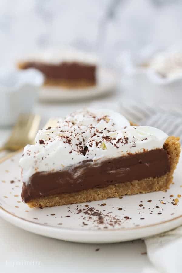 A slice of chocolate pudding pie on a white plate.