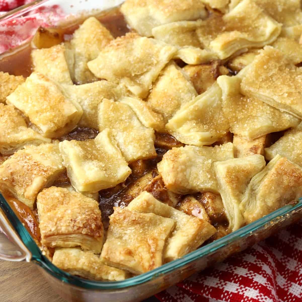 Baked apple pandowdy in glass baking dish.
