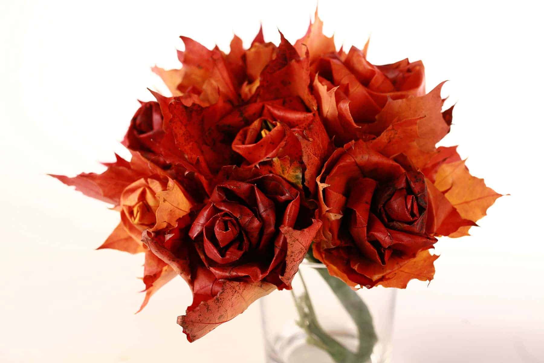 DIY maple leaves roses in a clear glass vase.
