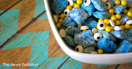 Minions muddy buddies snack mix with googly eyes in a white bowl.