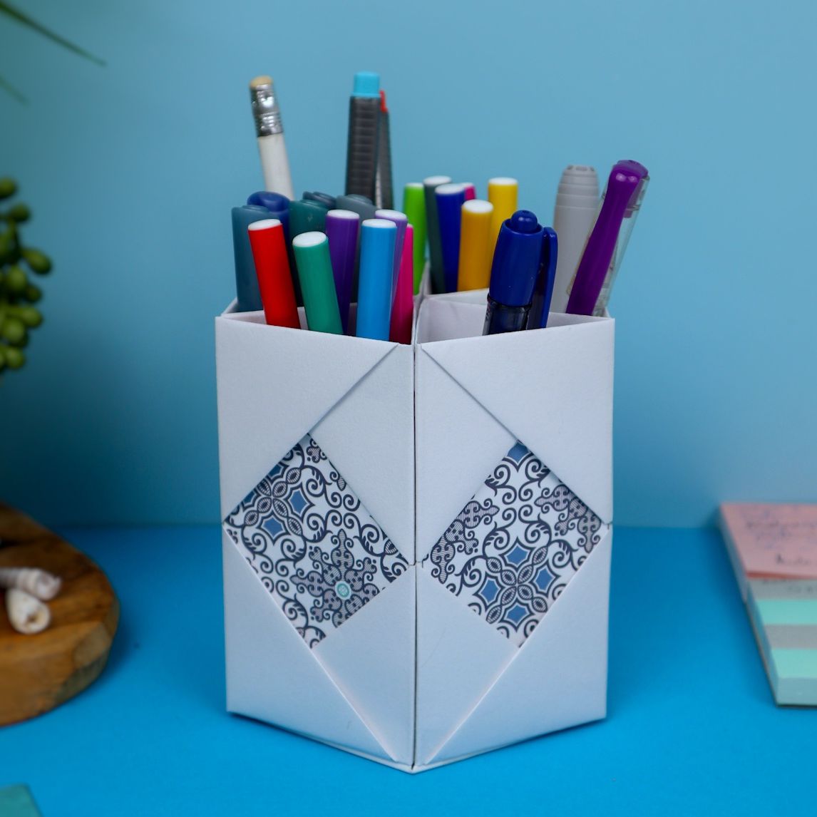 Pen and pencil holder craft out of paper.
