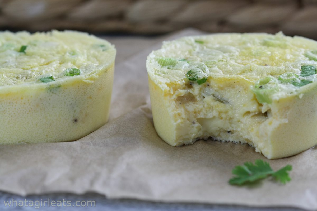 Close up photo of two egg cups with bite out of one of them.