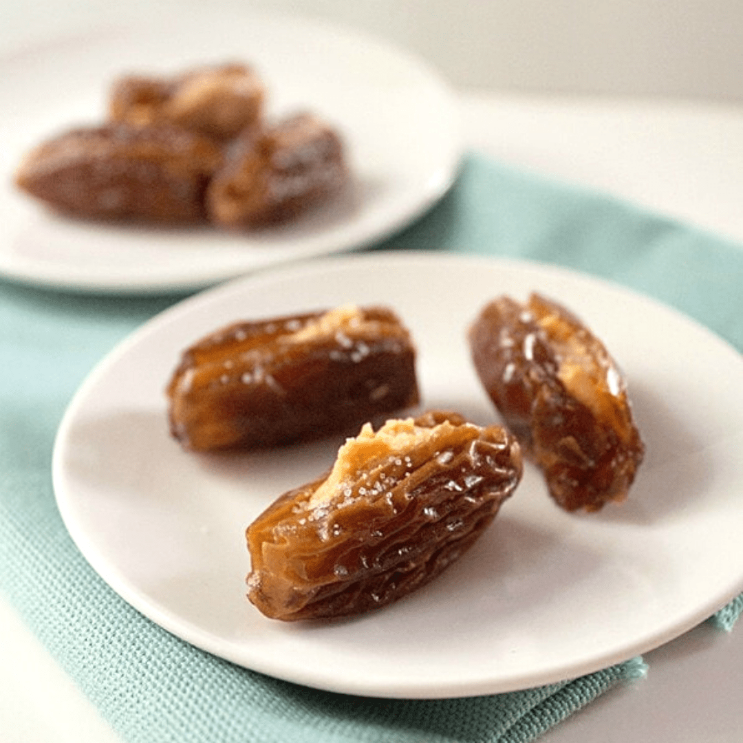 Two plates of stuffed dates.