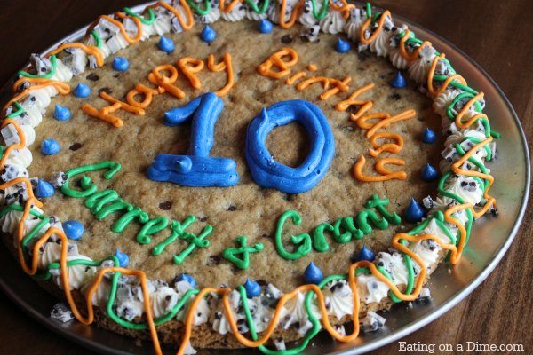 Giant chocolate chip cookie cake with number ten frosting.