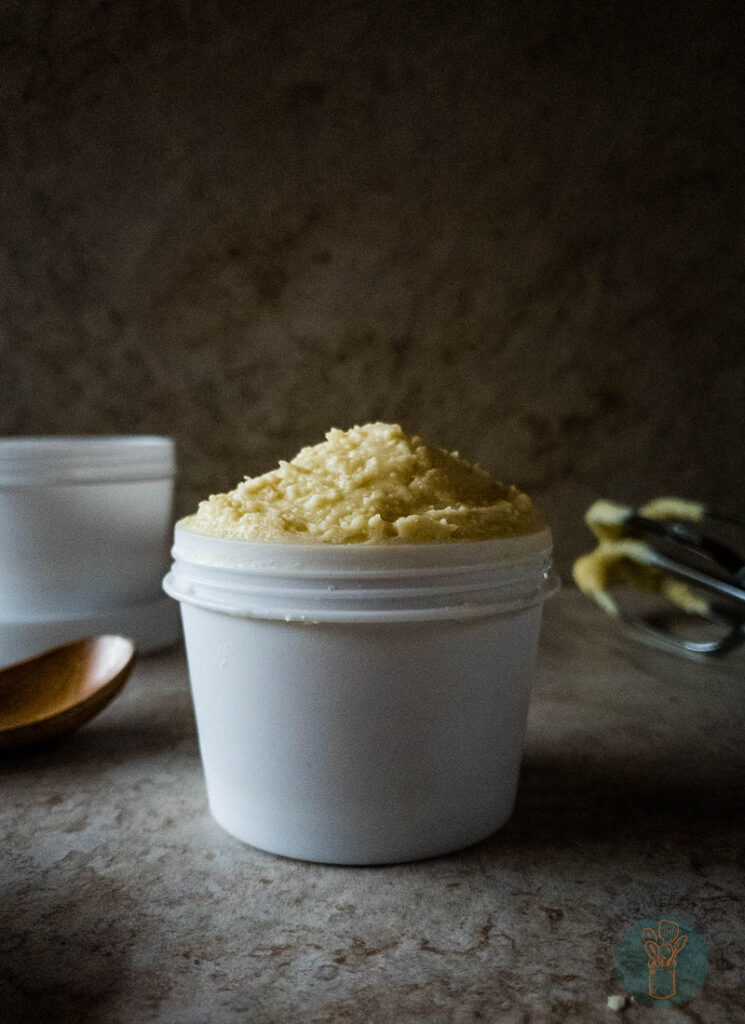 Beard butter in white container without lid.