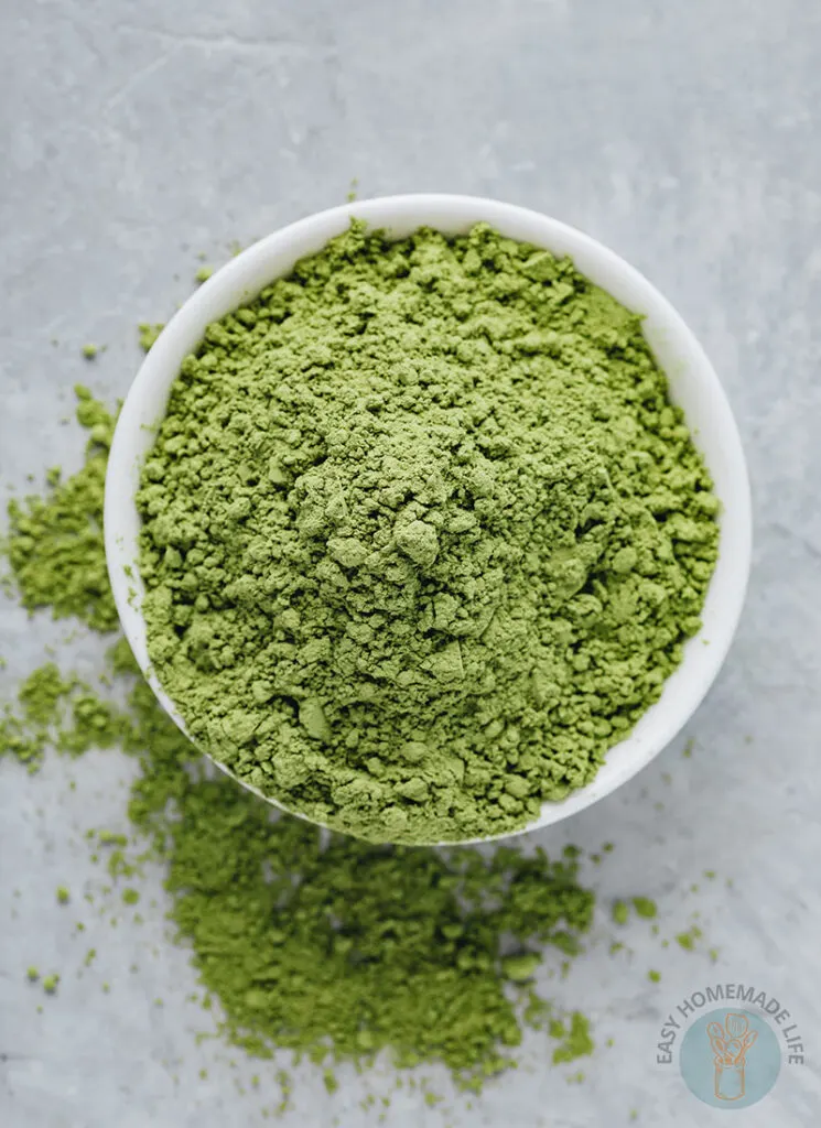 Matcha powder in a white bowl.