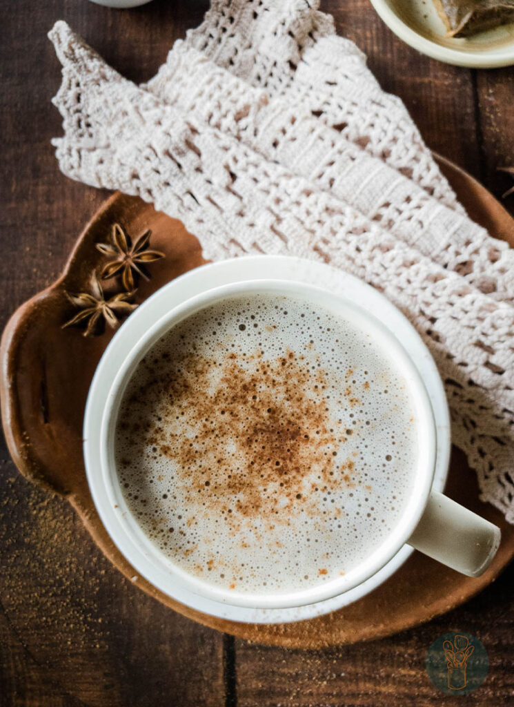 Hot chocolate chai tea in white teacup.