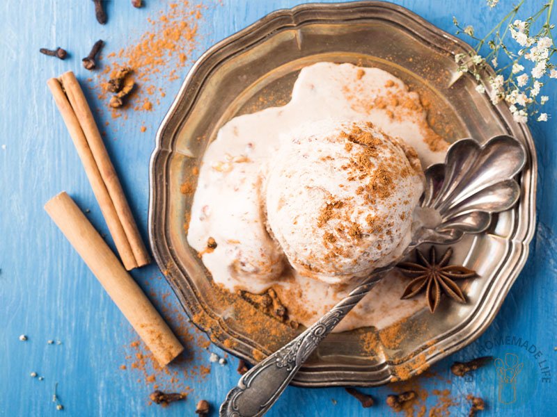 A scoop of chai ice cream garnished with cinnamon powder.