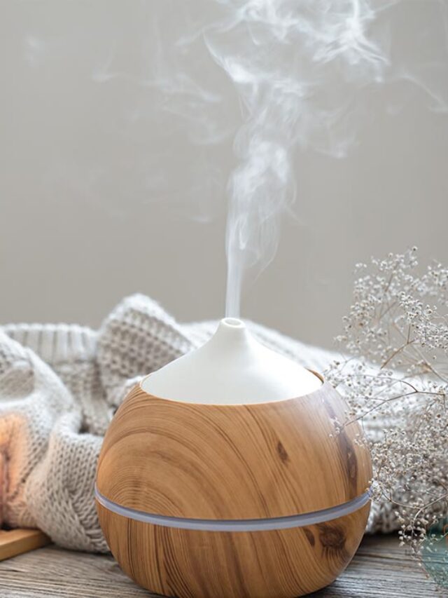 An essential oil diffuser sitting on a wooden table.