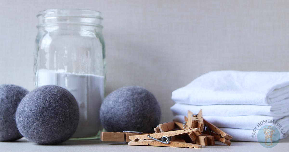 Felt balls next to a jar with clothespins.