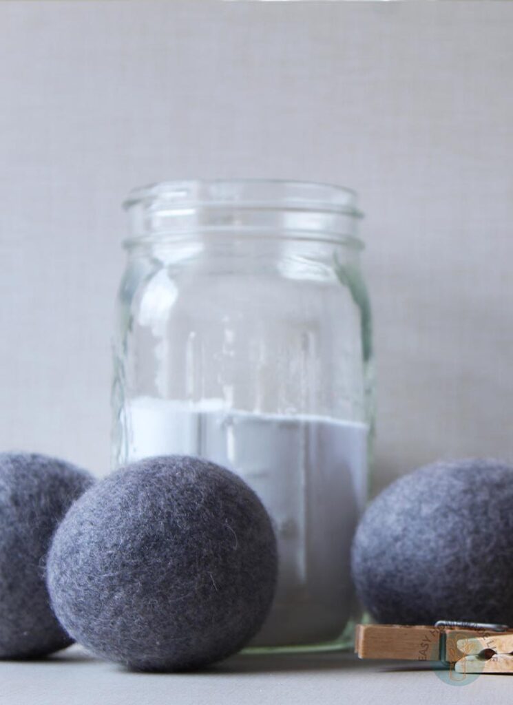 Wool dryer balls near a jar with detergent.