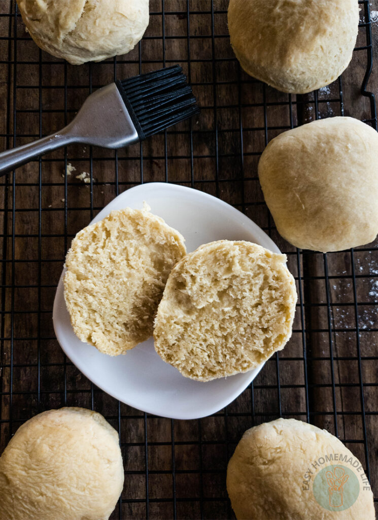 Bicuits on a white plate cut in half.