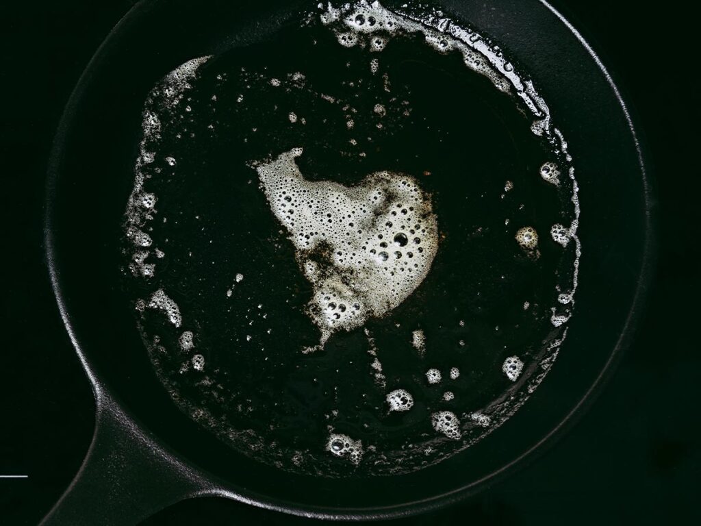 A cast iron skillet with soapy water.