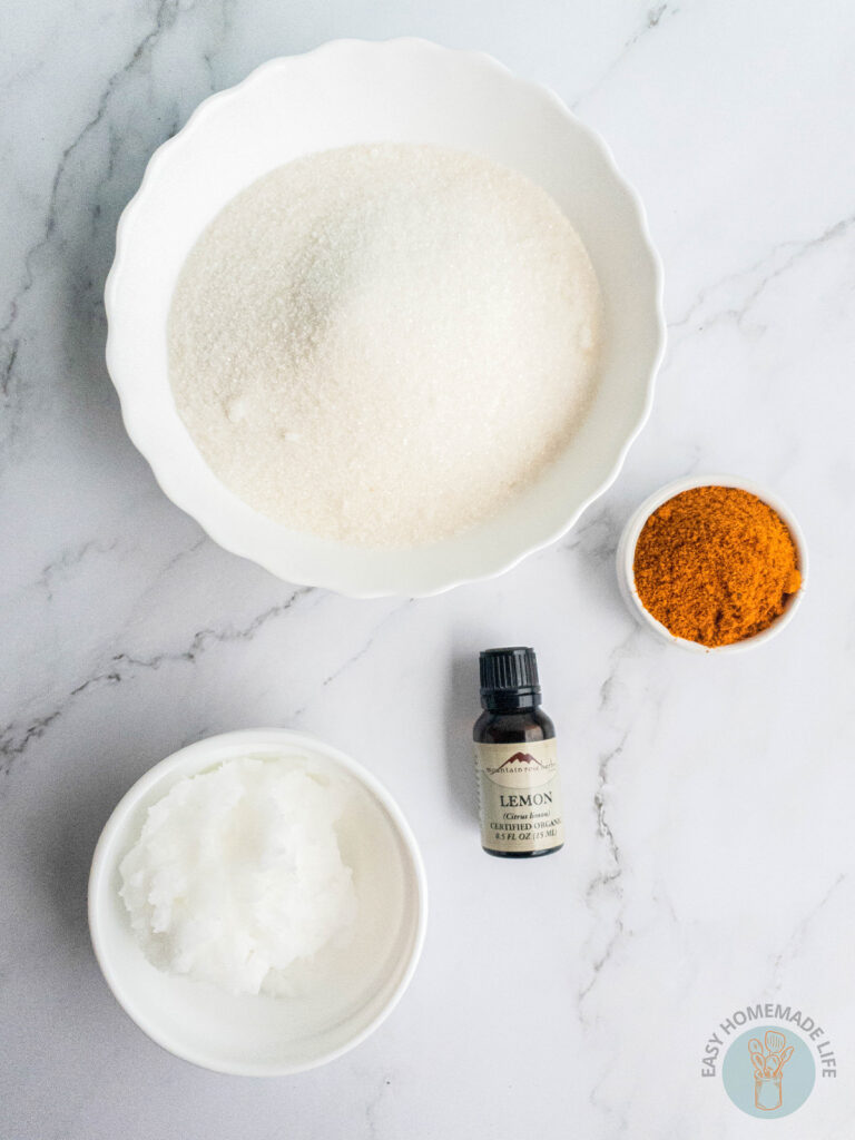 Turmeric body scrub ingredients in separate bowls.