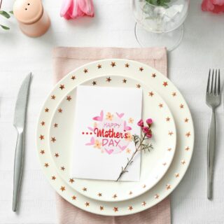 place setting at a table with a Happy Mother's Day card on the plate