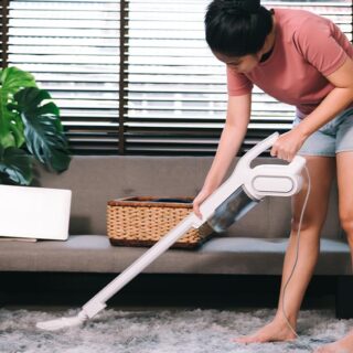 housewife cleaning carpet