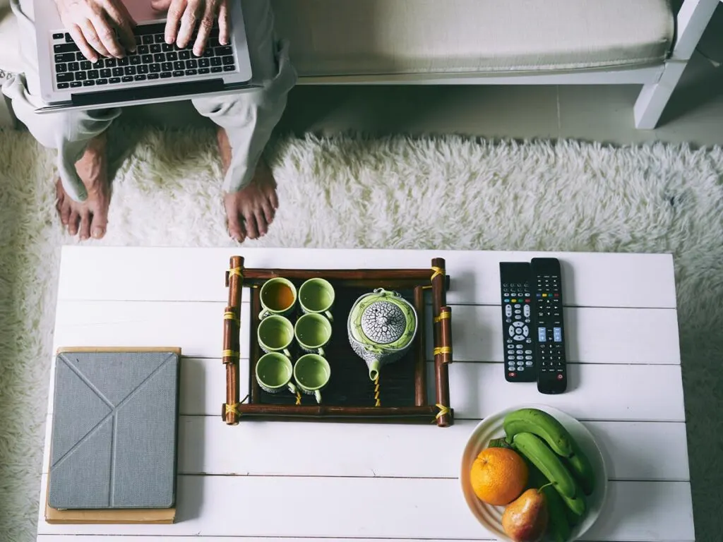 A coffee table on top of shag carpet.