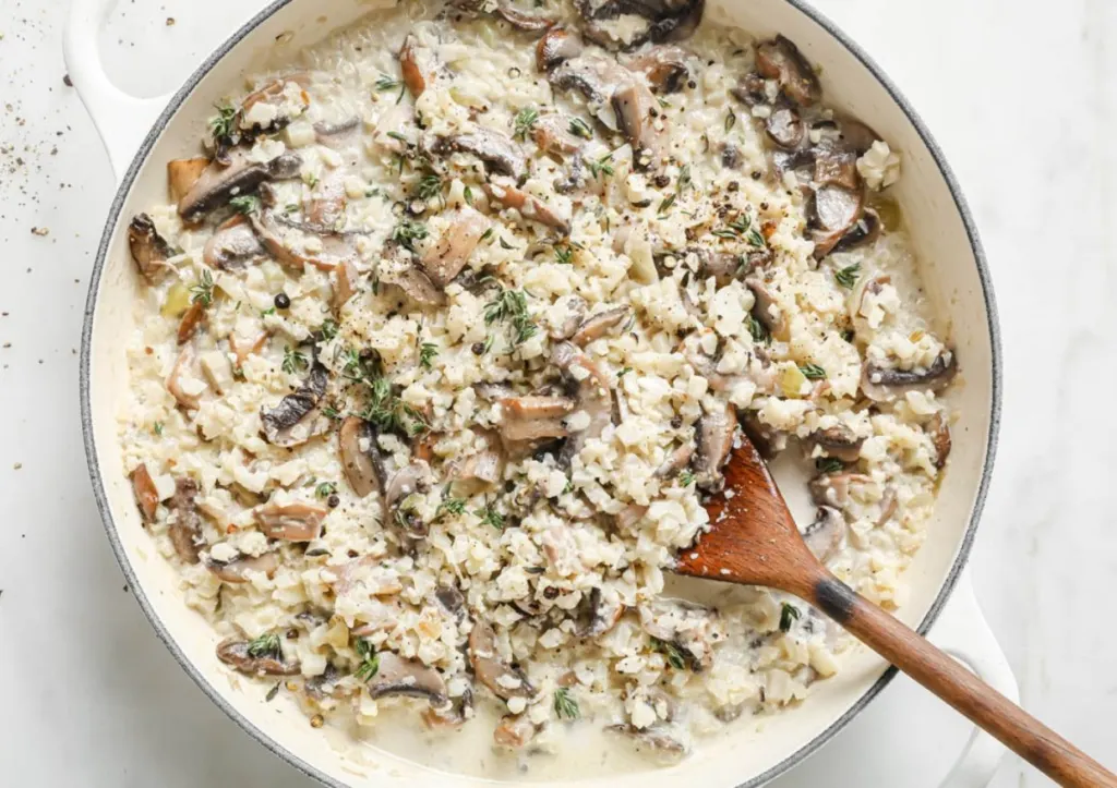 recipe using frozen cauliflower rice in pot with wooden spoon