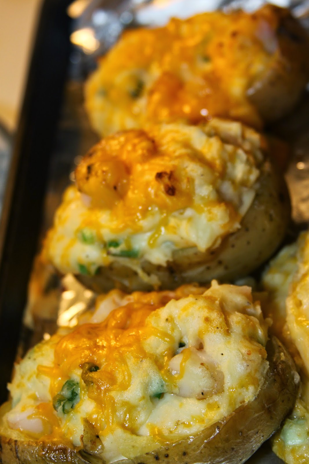 Three cheesy stuffed potatoes.