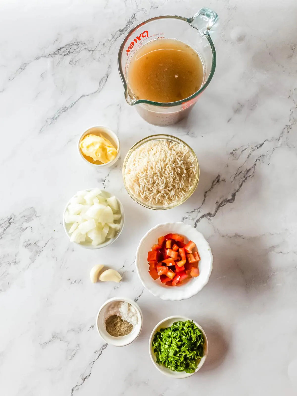 Ingredients for Longhorn Steakhouse rice on a marble countertop.