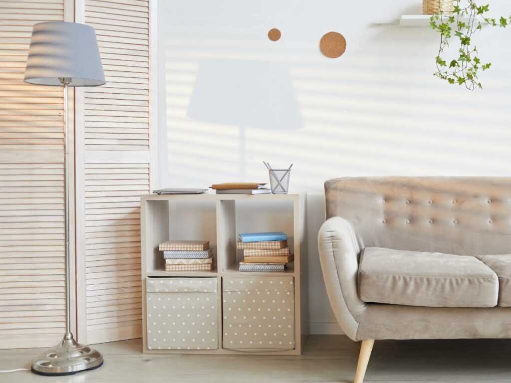 A living room with decorative boxes for decluttering.