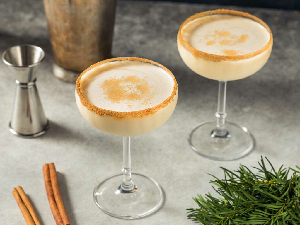 Two martini glasses with eggnog.