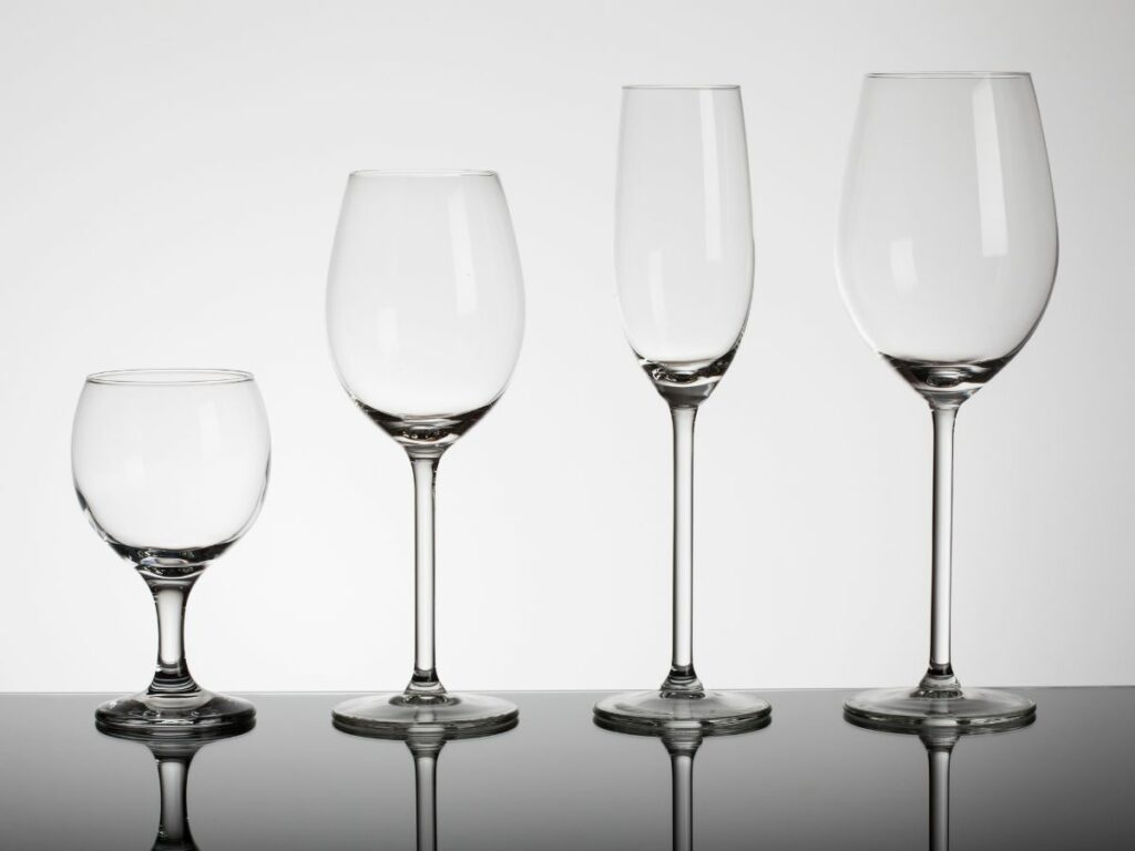 A variety of empty wine glasses.