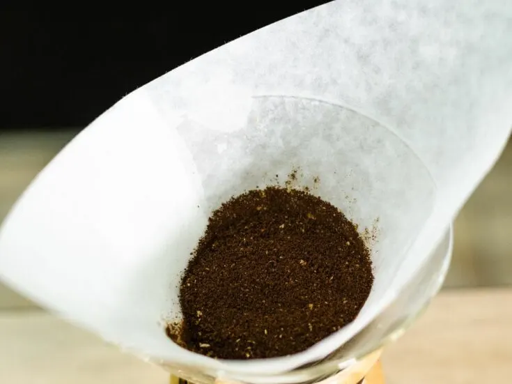 A coffee filter with coffee in it.