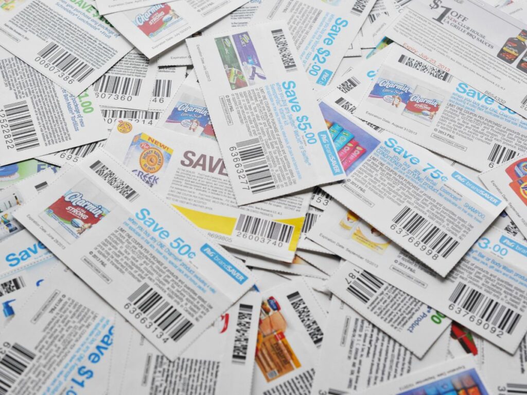 A pile of food coupons on a table.