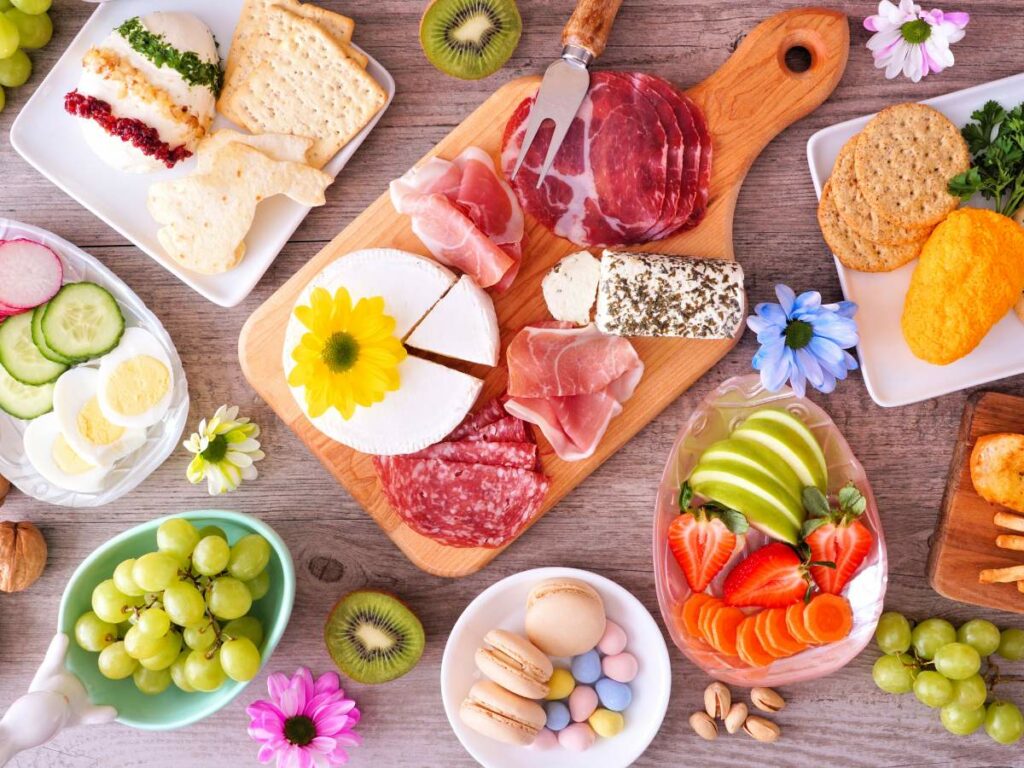 A variety of Easter food on a wooden table.