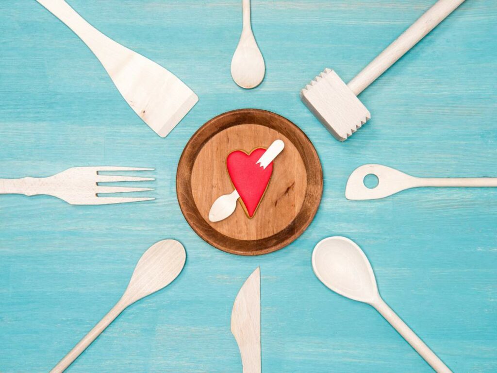 A plate of utensils with a heart on it.