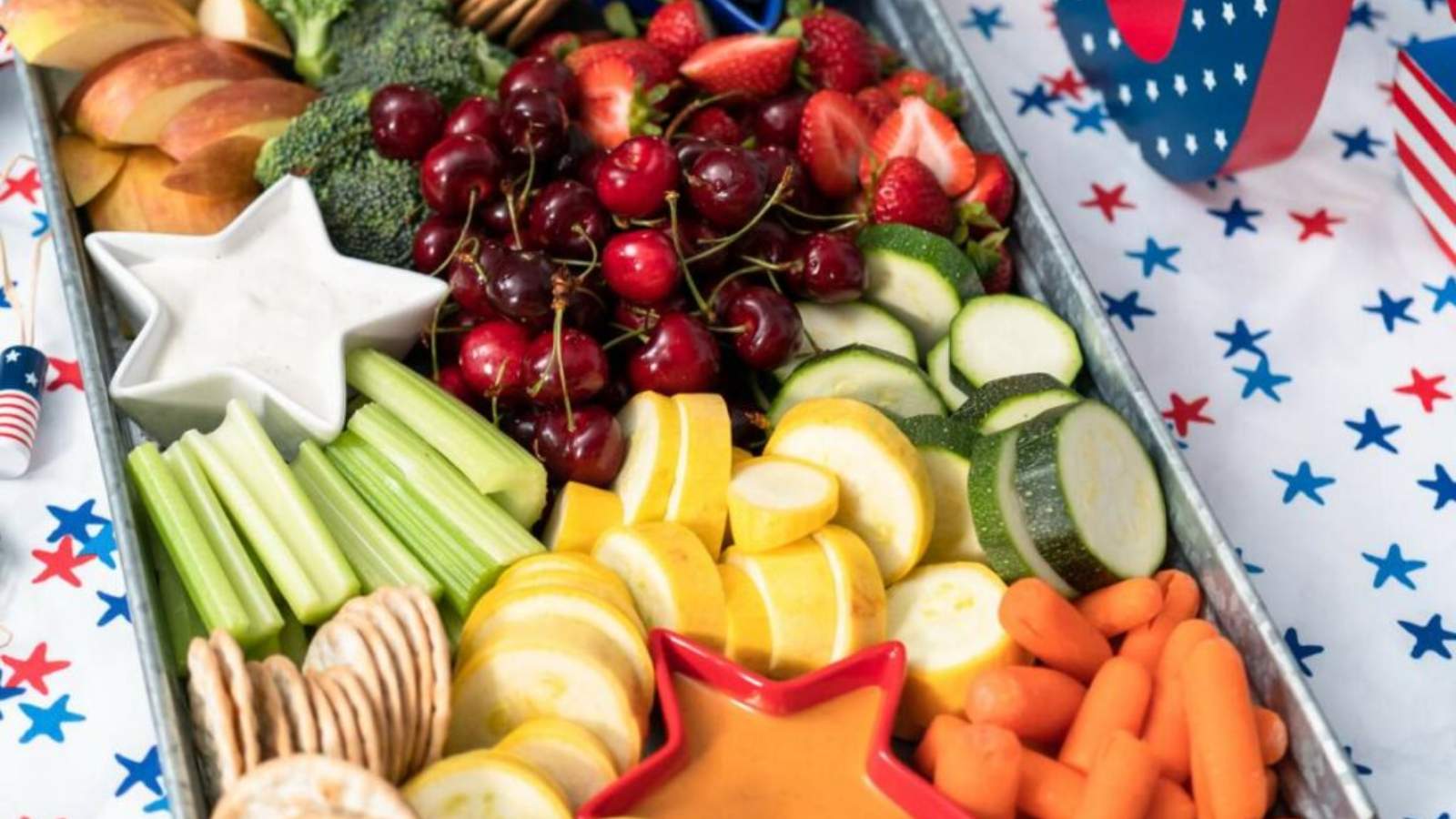 A tray of assorted fresh fruits and vegetables.
