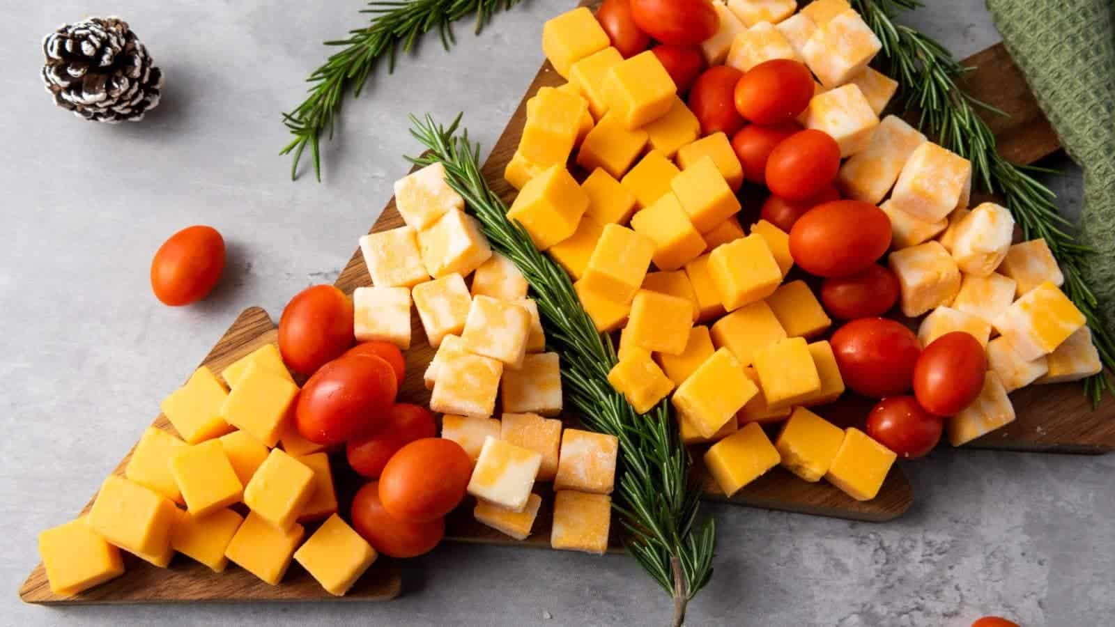 Christmas tree cheese platter on a light colored surface.