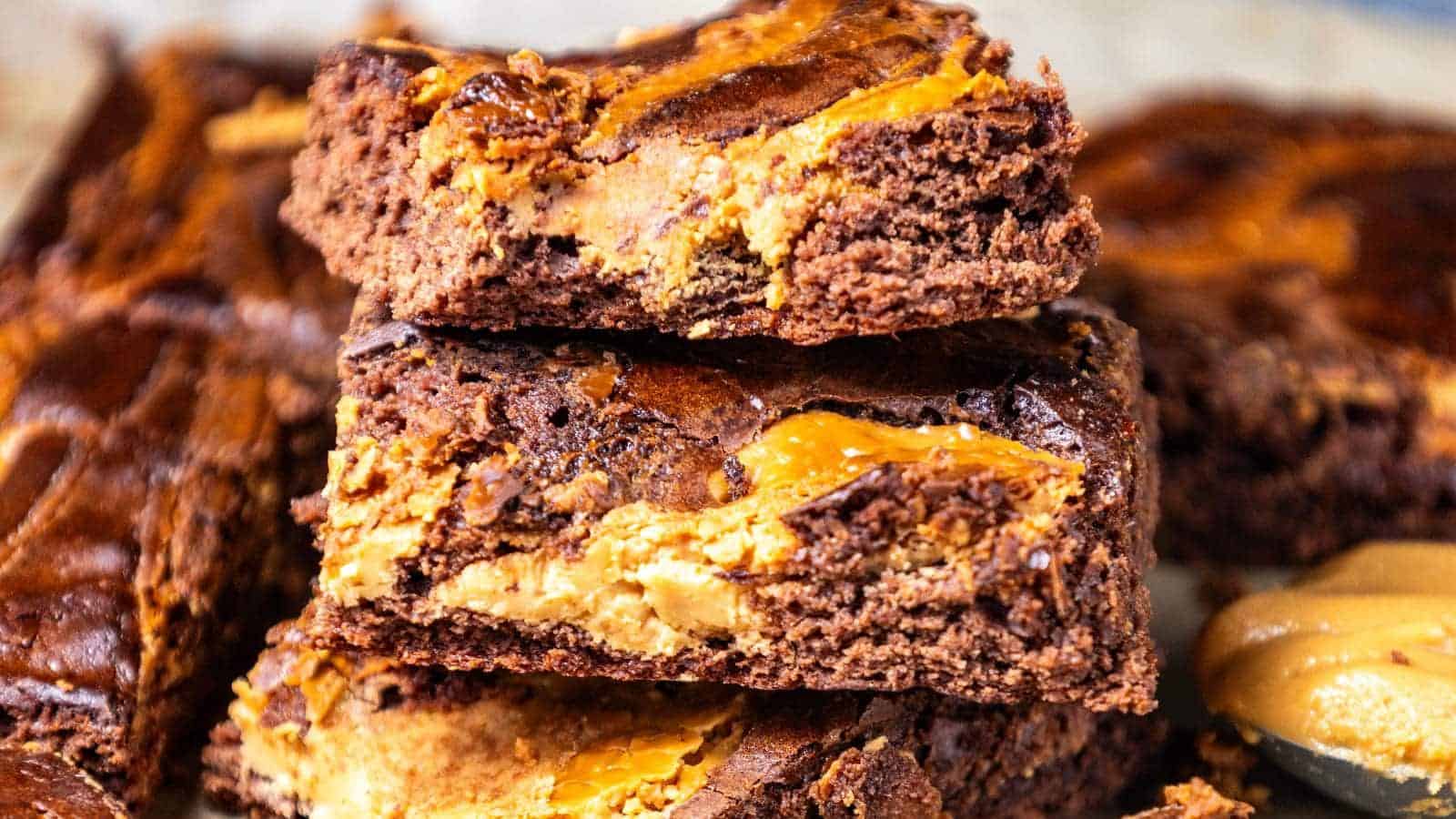 Close-up of three peanut butter brownies stacked on top of each other.