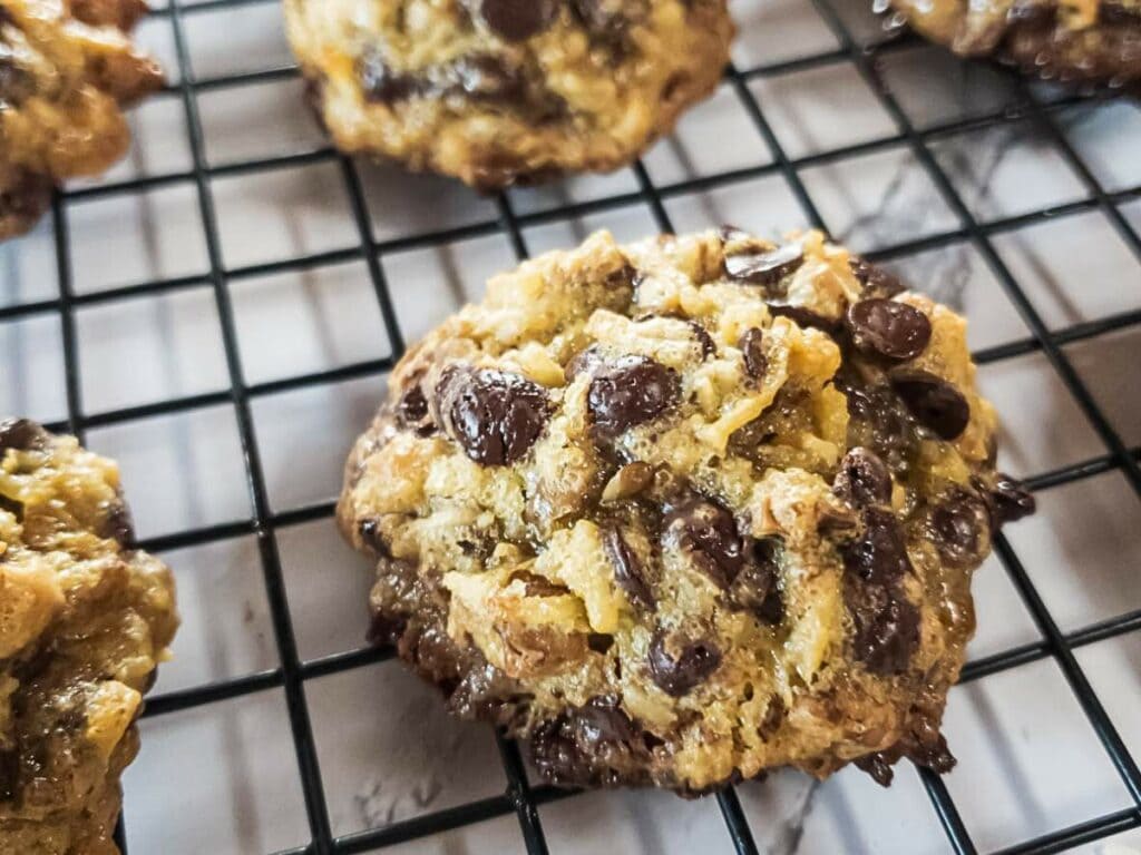 Magic cookie cooling on a black wire rack.