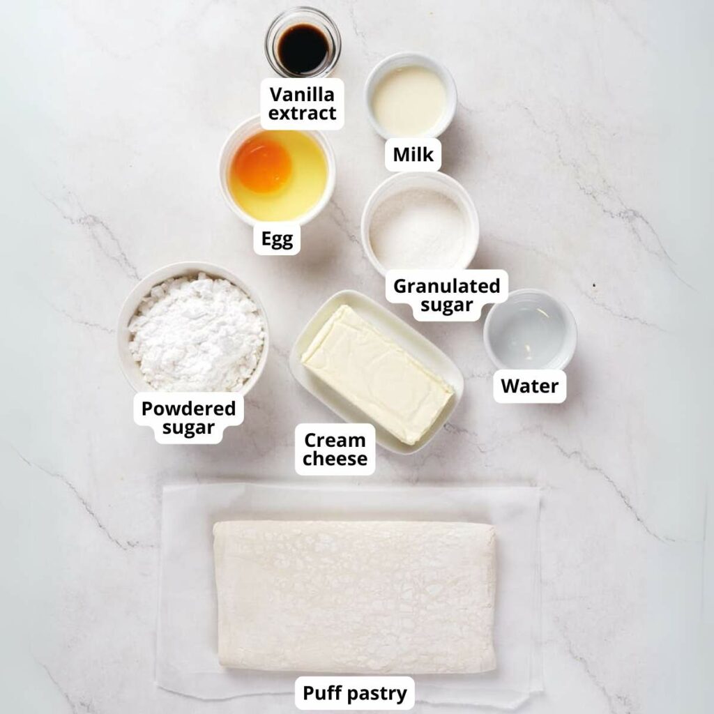 Ingredients for cheese danish arranged on a white surface.