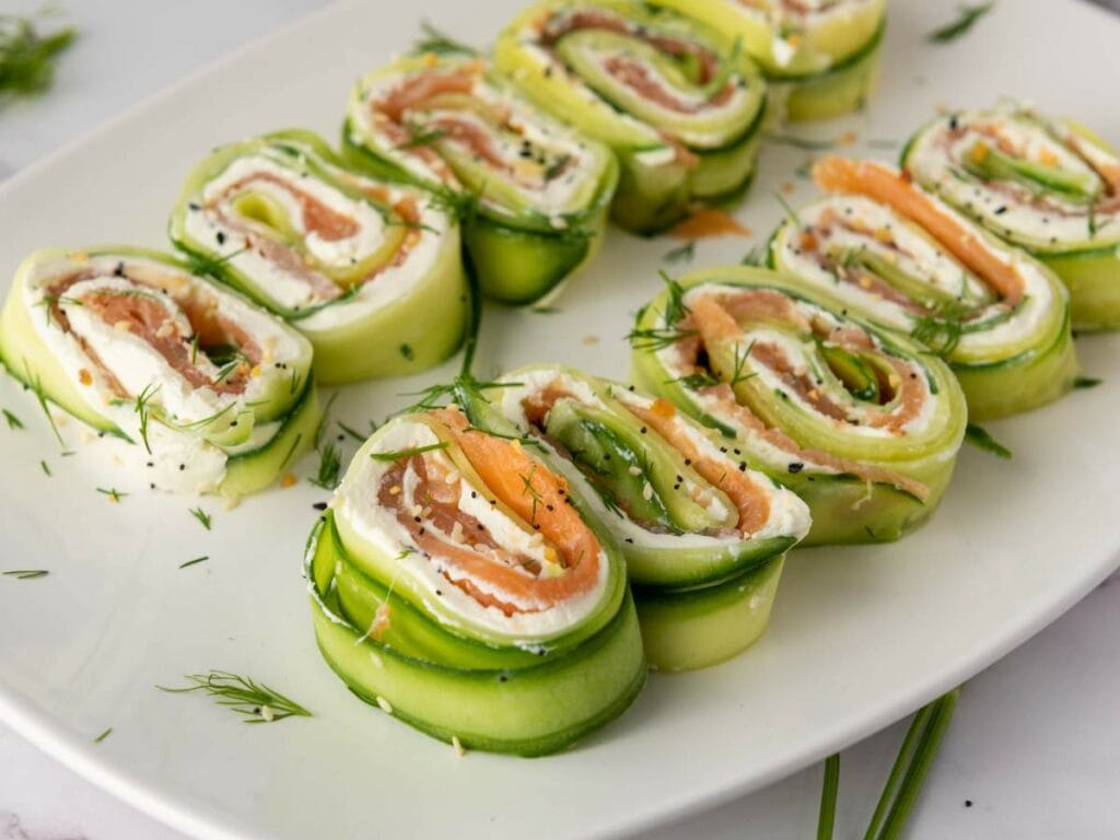 Slices of cucumber pinwheels filled with cream cheese and salmon.