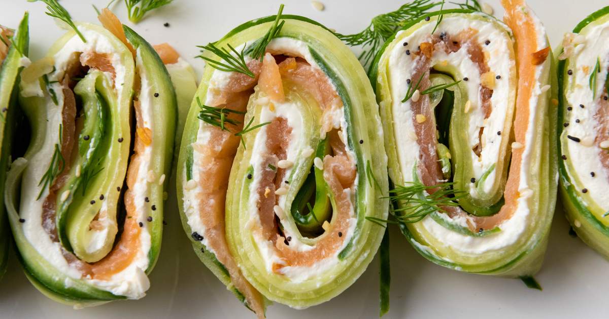 Close-up of cucumber pinwheels filled with smoked salmon, cream cheese, and fresh dill.