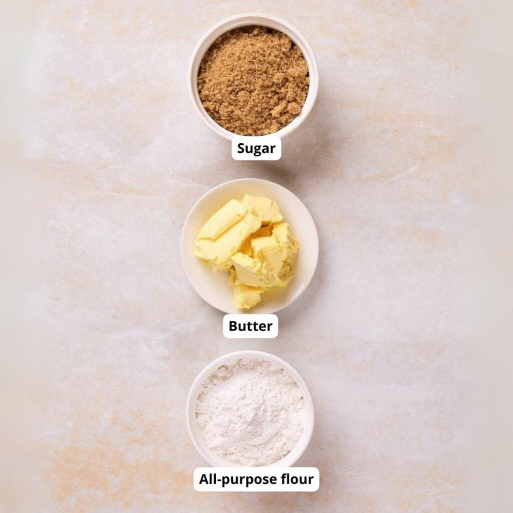 Three bowls containing sugar, butter, and all-purpose flour.