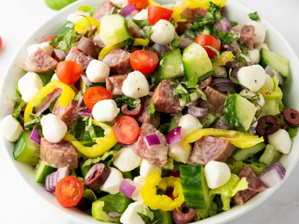 A bowl of italian salad with all the ingredients.