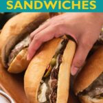 Italian Beef Sandwiches on a wooden board with website easyhomemadelife.com.