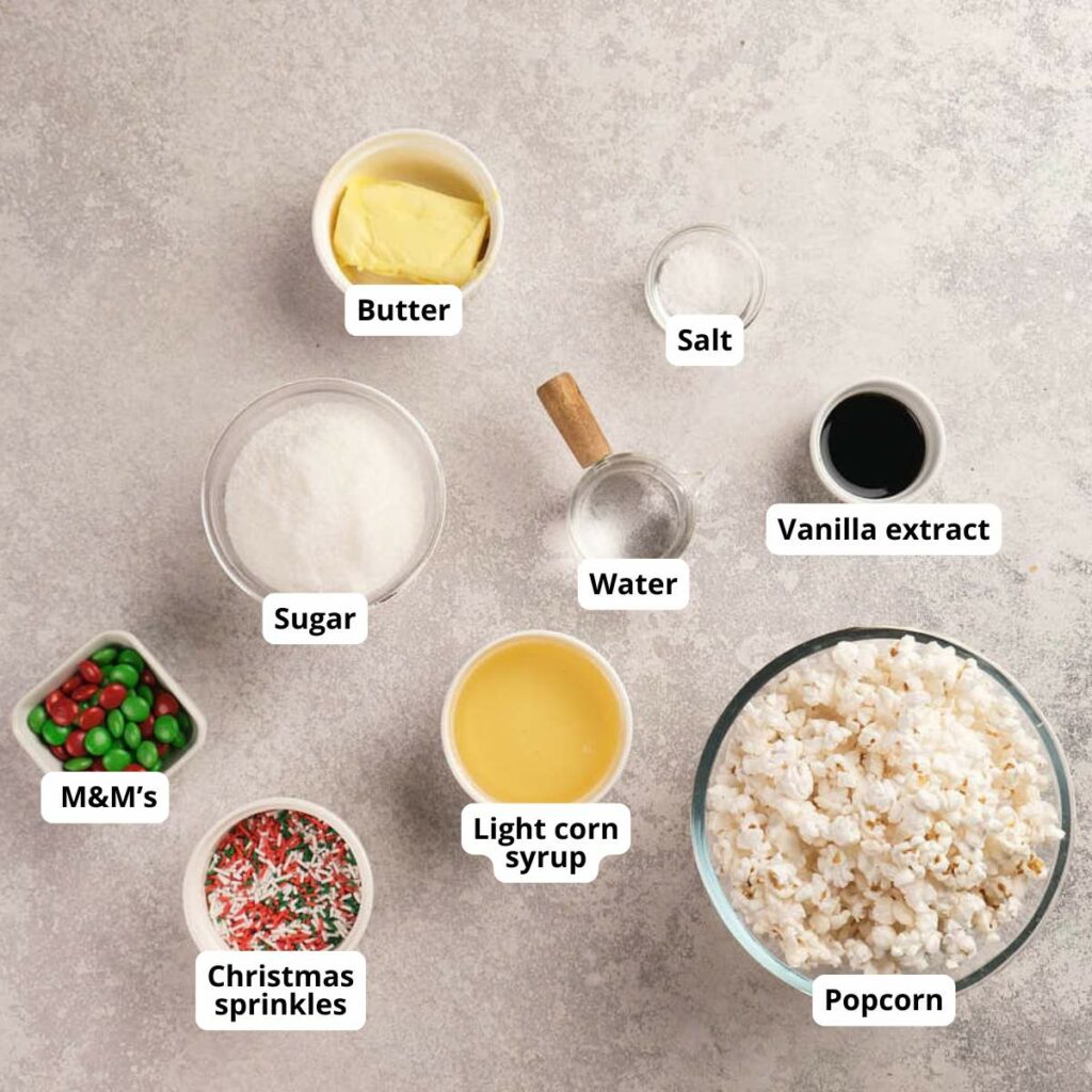 Ingredients for holiday popcorn balls are arranged on a countertop.
